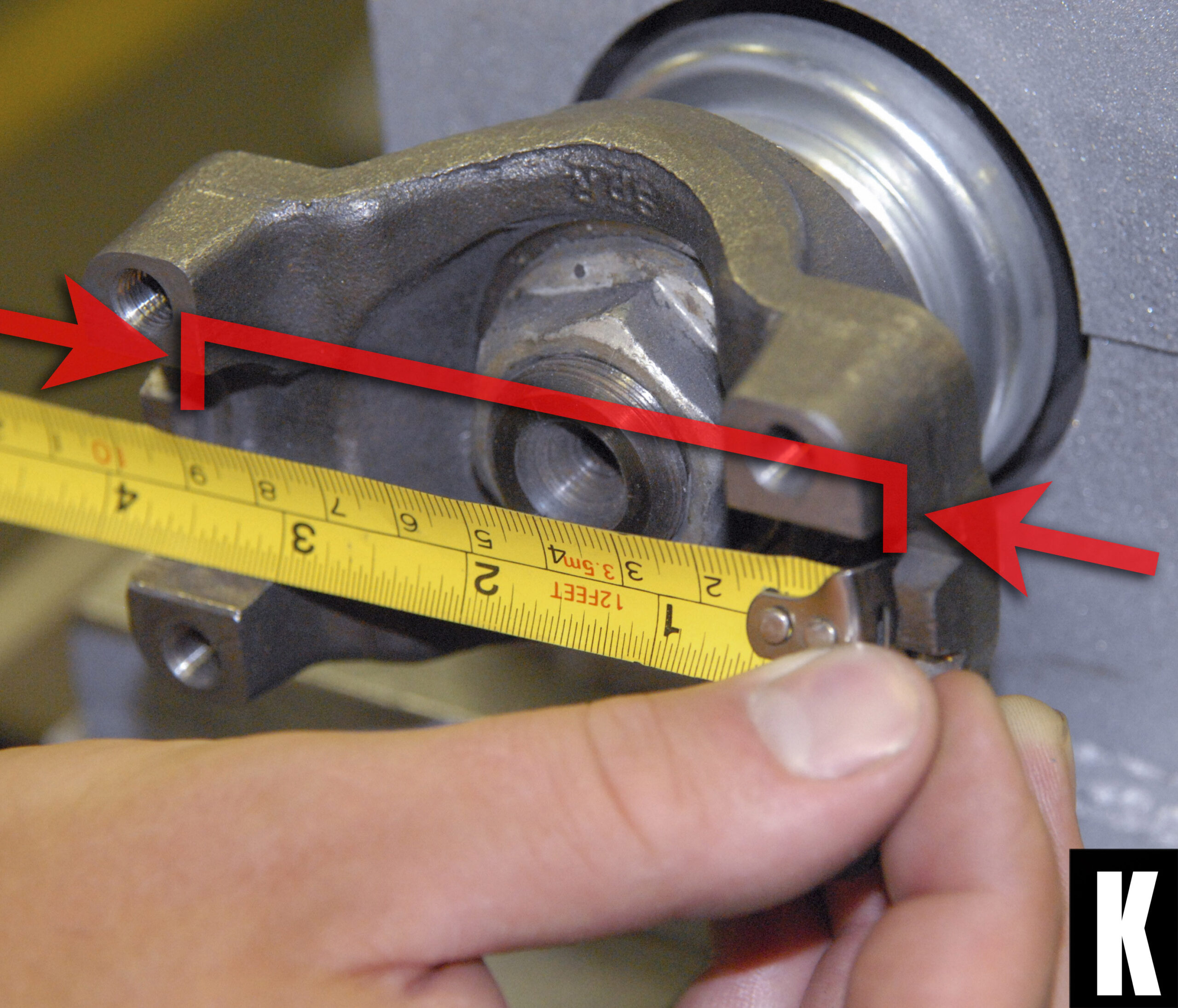 how to measure the distance between the locating tabs on the pinion flange